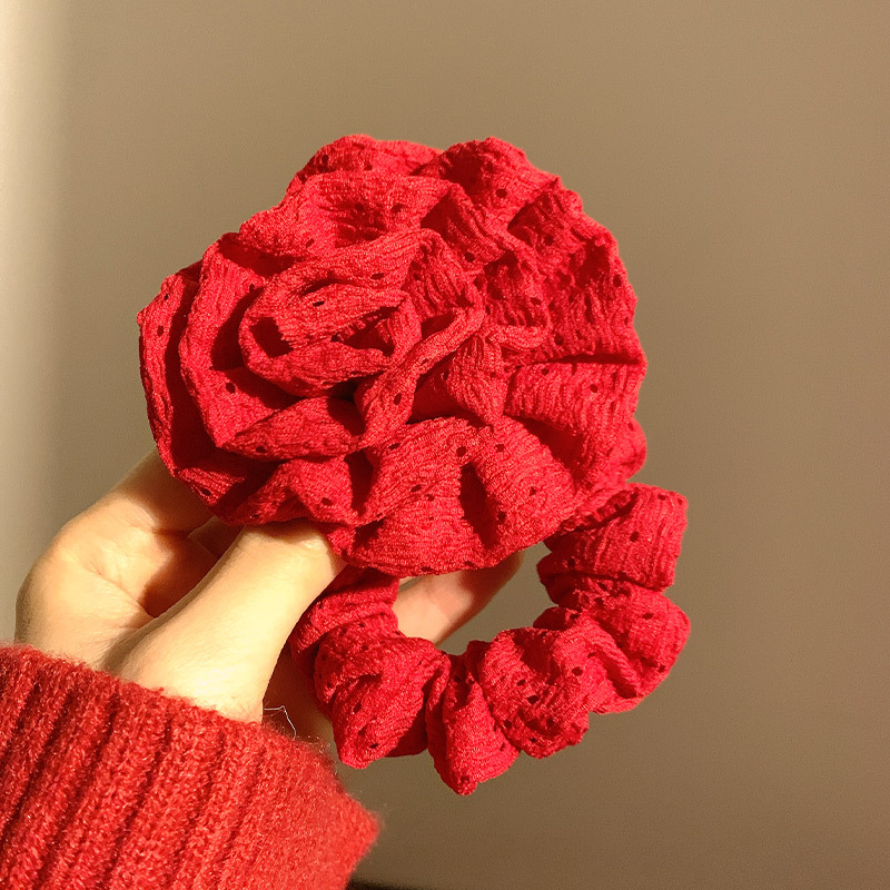 Roseta roja para el cabello