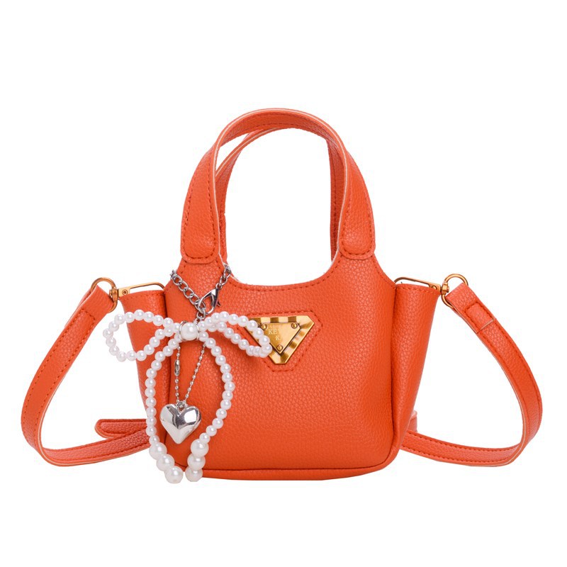 Bolso de canasta de comida portátil para niña lindo bolso de mensajero para niños con lazo de perlas mini bolso para niños de color sólido