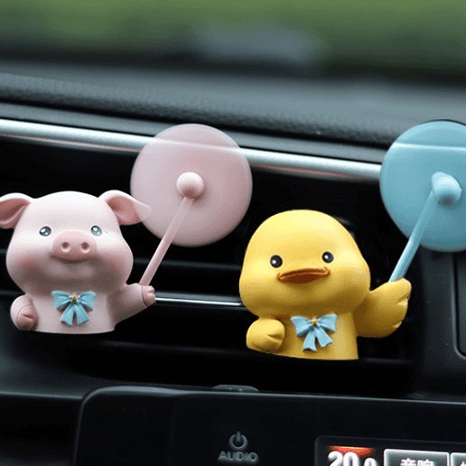 Aire acondicionado del automóvil salidas de aire decoraciones aromáticas dibujos animados lindo cerdo coche eléctrico consola adornos de perfume montados en el automóvil