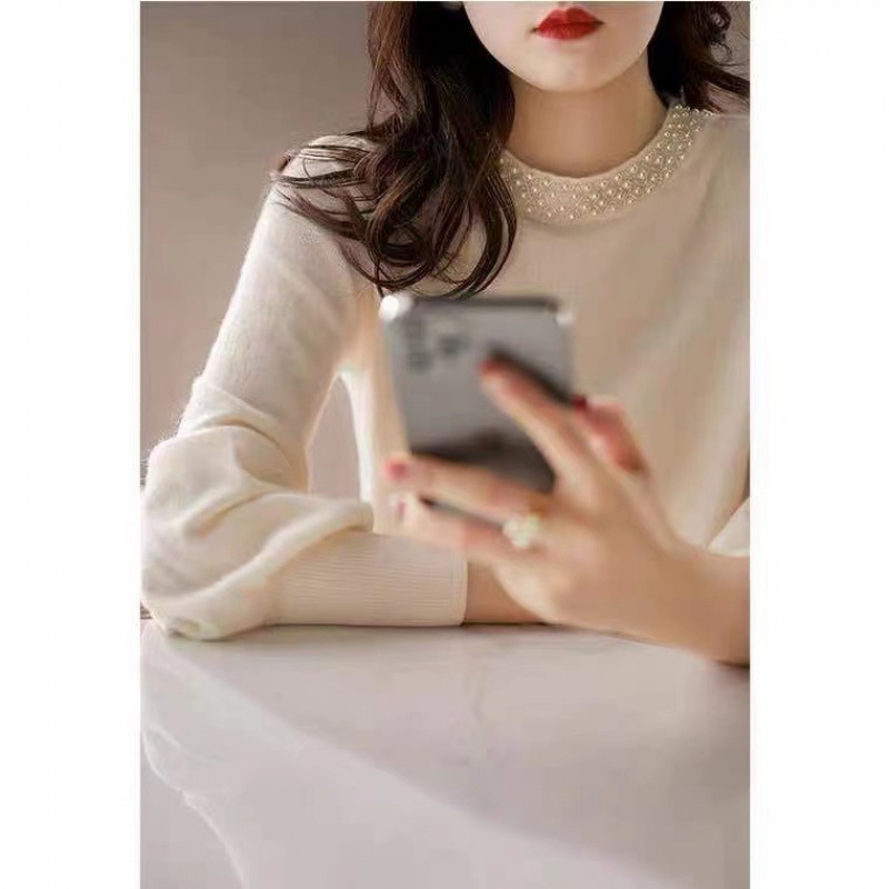 Fashionable sweater with a round collar