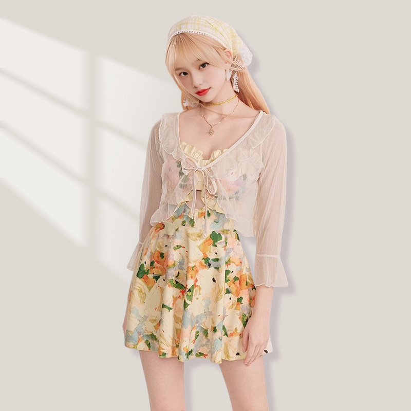 Trajes de baño divididos de mujer temperamento francés vestido de té de flores cortas de verano de manga larga protección solar trajes de baño de vacaciones mujeres