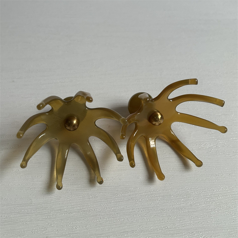 Octopus Head Scalp Massage Comb Meridian Brush Tool for Scalp Care and Relaxation 7 x 6.5 cm in use