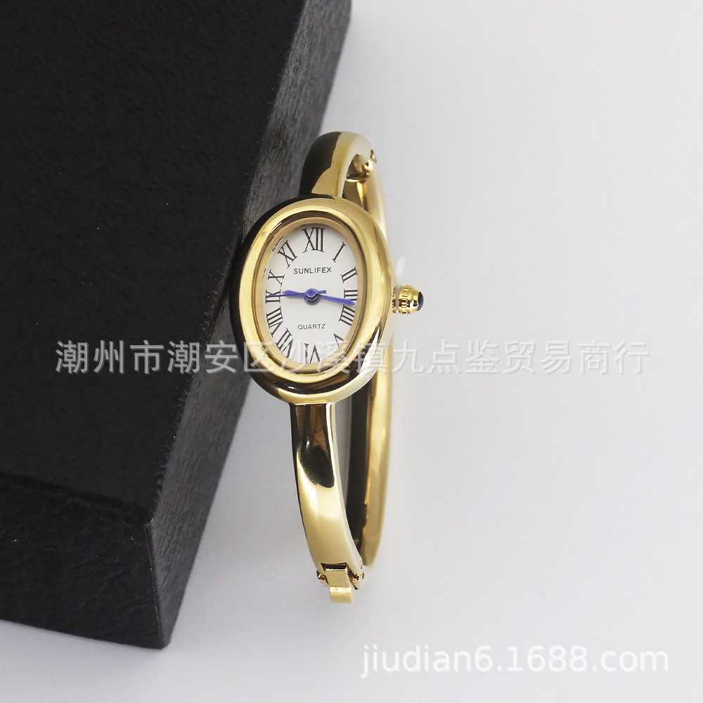 Gold strap white dial watch