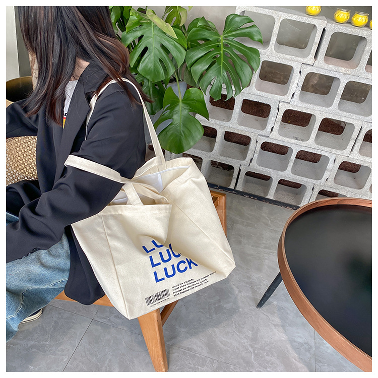 A large-capacity, sturdy Japanese-style canvas bag for women, a new 2022 simple bento handbag for girls to go to work undefined