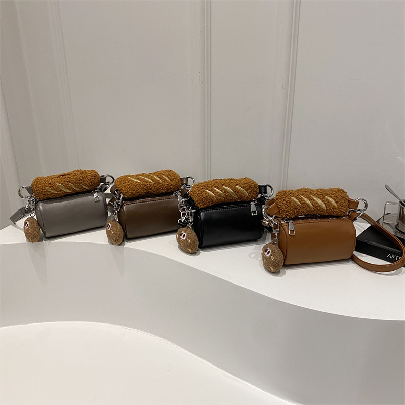 2025 otoño y invierno nuevo bolso infantil de moda coreana mini niñas bolso de peluche lindo colgante bolso cilíndrico