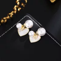 Small design earrings from pearl, silver 925 sample