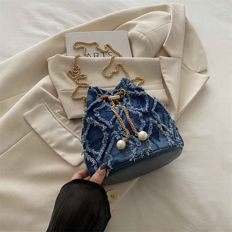 Nicho de diseño bolso de cubo otoño 2024 nuevo bolso de cordón de dibujo bolso de mujer mochila de moda simple bolso de hombro