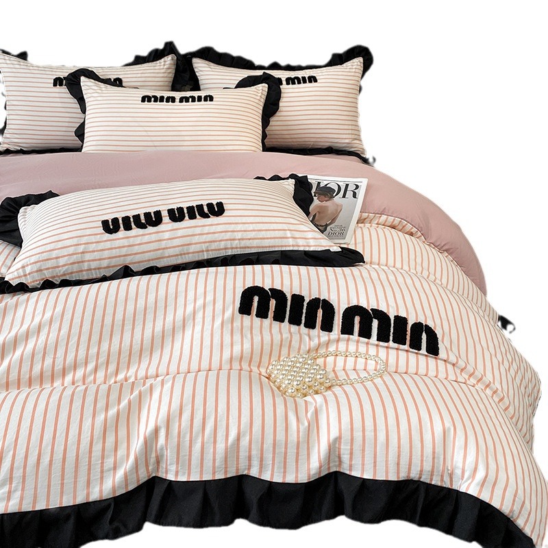 2024 nuevo estilo francés pequeño bordado de toalla de fragancia cuatro piezas funda de edredón sábana simple ropa de cama Nantong al por mayor