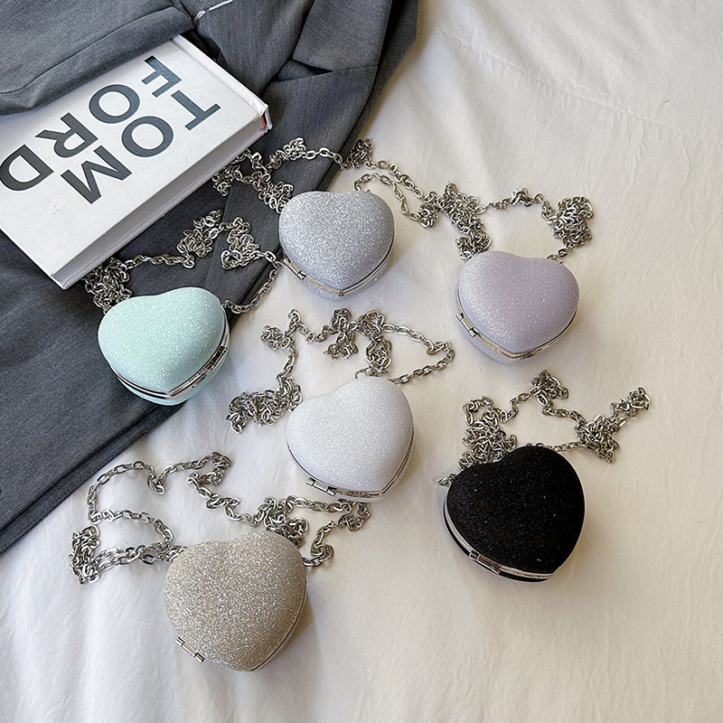 Pequeño viento japonés de fragancia personalidad de color caramelo de corazón de melocotón mini auriculares para mujeres bolsas de 24 verano nuevo hombro mochila