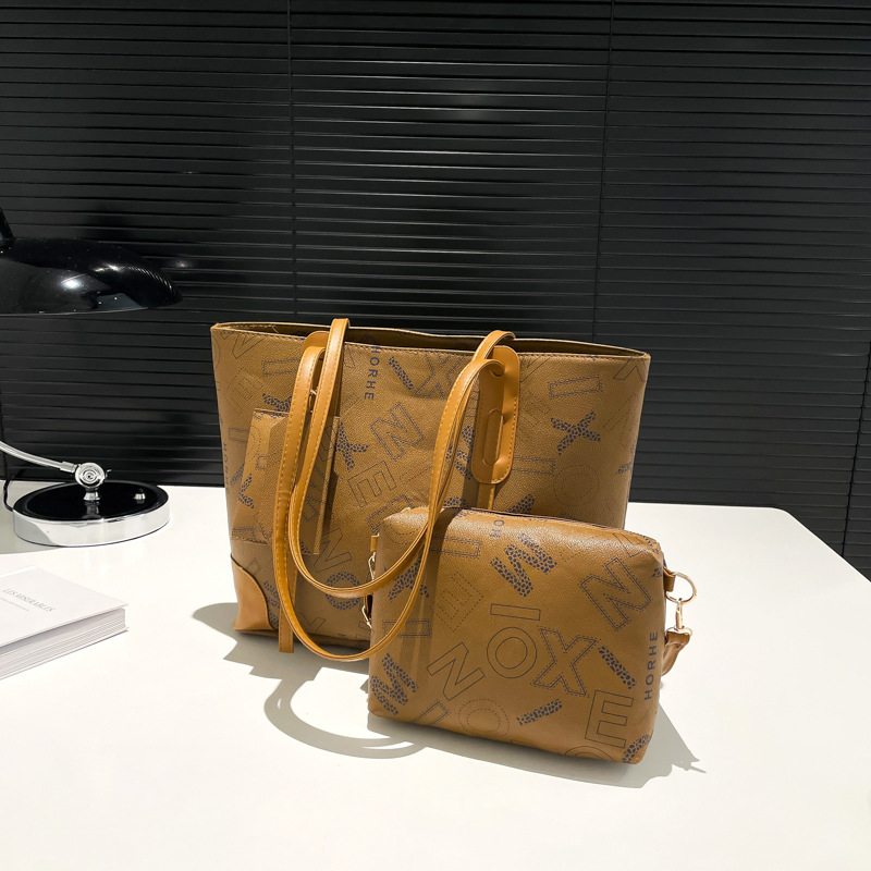 Bolsa de impresión de letras retrógradas para mujeres 2025 primavera nueva bolsa de hombro de gran capacidad bolsa de moda portátil brazo