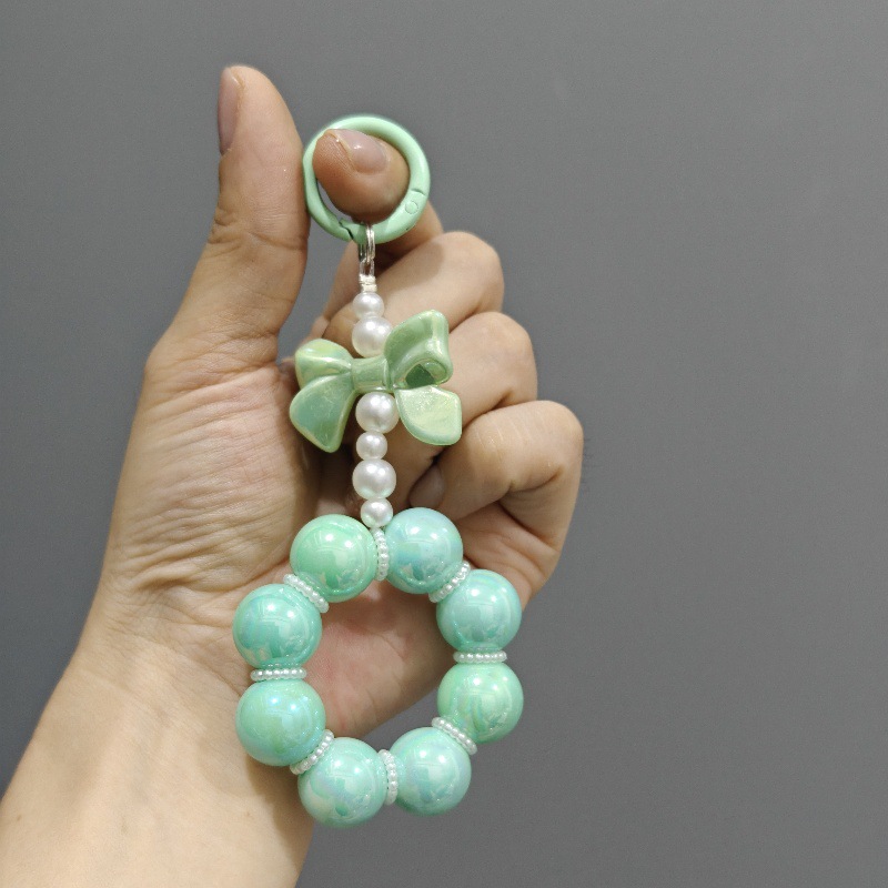 Nueva electrochapado cuentas arco llavero del coche colgante lindo caramelo color pintura anillo de perlas accesorios bolsa Decoración