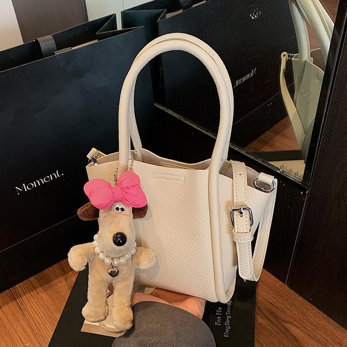 Bolso de cubo de mano de estilo explosivo transfronterizo para mujer 2025 nuevo bolso de hombro de alta gama de nicho bolso de cesta de verduras de moda coreana