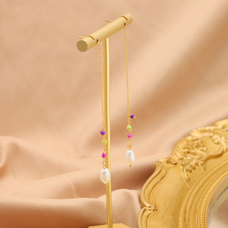 Pendientes de perlas naturales de agua dulce pendientes femeninos nicho de alto grado pendientes anillo de joyería original hecho a mano transfronteriza al por mayor