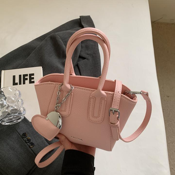 Bolso de cubo portátil de estilo caliente de moda para mujer 2025 nuevo bolso de hombro retro de nicho bolso de mensajero de moda de todo fósforo de moda