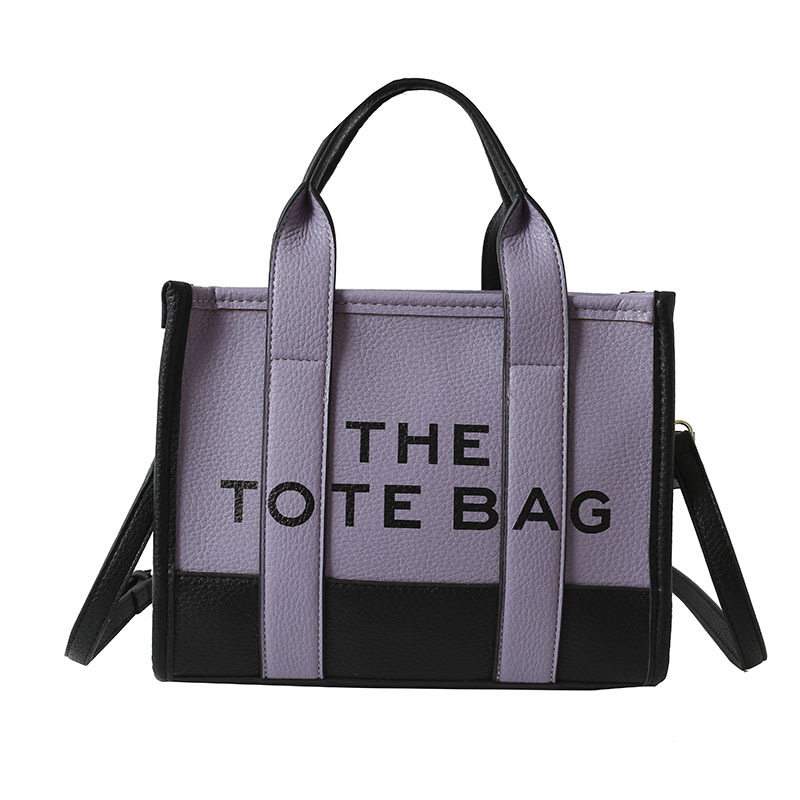 Bolso tote de comercio exterior para mujer 2023, nuevo bolso de mano moderno europeo y americano, bolso bandolera con estampado de letras y bloques de color.