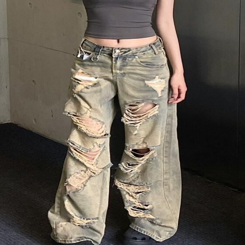 Large American wasteland style distressed washed high street ripped jeans with loose wide leg design for both and_voghion.com