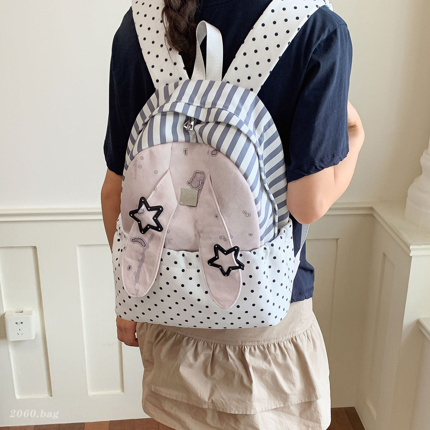 Universales estudiantes lindos clase de nicho ligero 2026 nuevas orejas de gran capacidad mochila de mujer mochila de punto de onda conejo