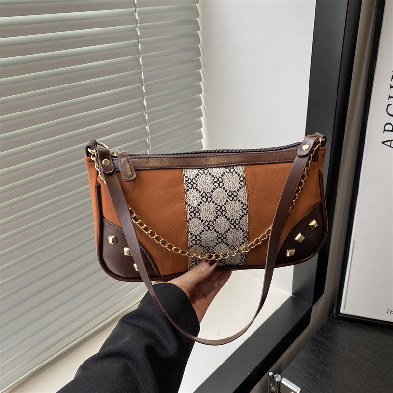 Bolso de mujer 2025 primavera nueva moda retro esmerilado empalme bolso de color contraste bolso de mujer un hombro brazo bolso de moda