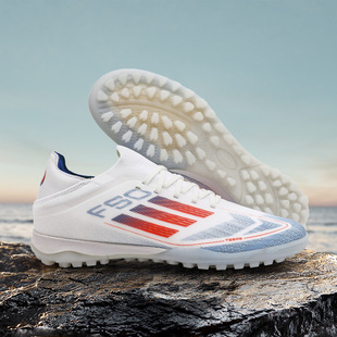 Wholesale cross-border Putian seamless flying woven Messi football shoes men's low-top youth spikes broken nails training sneaker