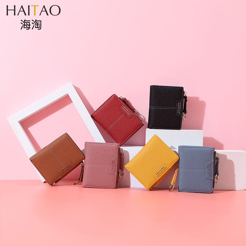 Cartera corta de mujer de color sólido de lujo ligero nicho Volkswagen gran capacidad dos carteras plegables cremallera mini bolso de cambio de mujer