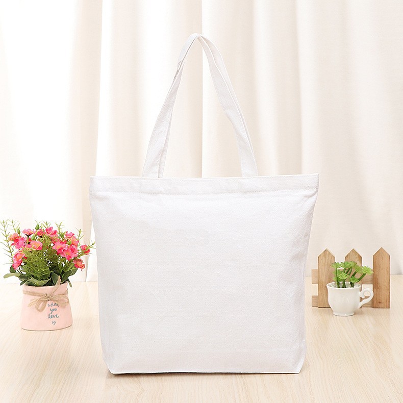 En stock bolsa de lona portátil en blanco personalizable logotipo de impresión en color de un solo hombro bolsa de compras bolsa de algodón de entrenamiento publicitario