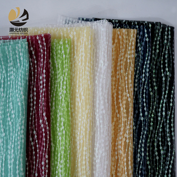 Fabricantes de venta de bajo precio ondulado fantasía polvo brillante tela de malla vestido de noche tela de boda