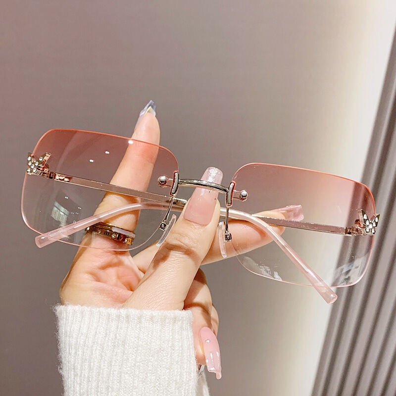 2026 new frameless square sunglasses for women, featuring ocean-colored lenses, cut-out edges, butterfly-shaped embellishments, diamond accents, and a fashionable gradient color design for sun protection