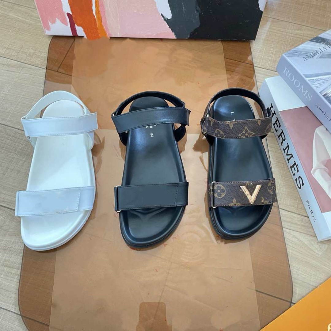 Donkey Home estación europea diseñador de alta versión 2025 nuevas sandalias de playa de cuero zapatillas de hebilla metálica plana