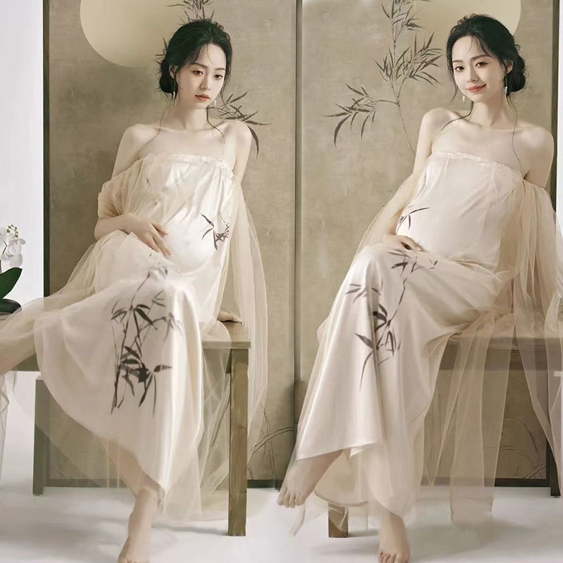 撮影のテーマの妊婦の新しい中国式の写真撮影の服装の妊娠するマミーの大きい腹は水墨画の風格を照らして長いスカートを撮影します。