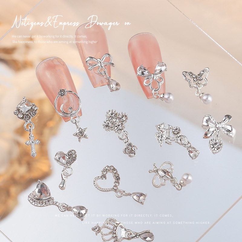 Nueva joyería de aleación de manicura completa diamante borla arco corona plata uñas manicura joyería accesorios al por mayor