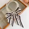 Necklace from pearl with letters