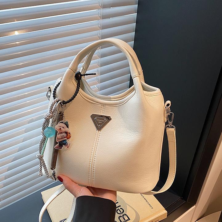 Bolsa de cubo de mano explosiva de comercio exterior para mujeres 2025 nueva moda bolsa de hombro ocio para viajar al trabajo de alta calidad bolsa madre