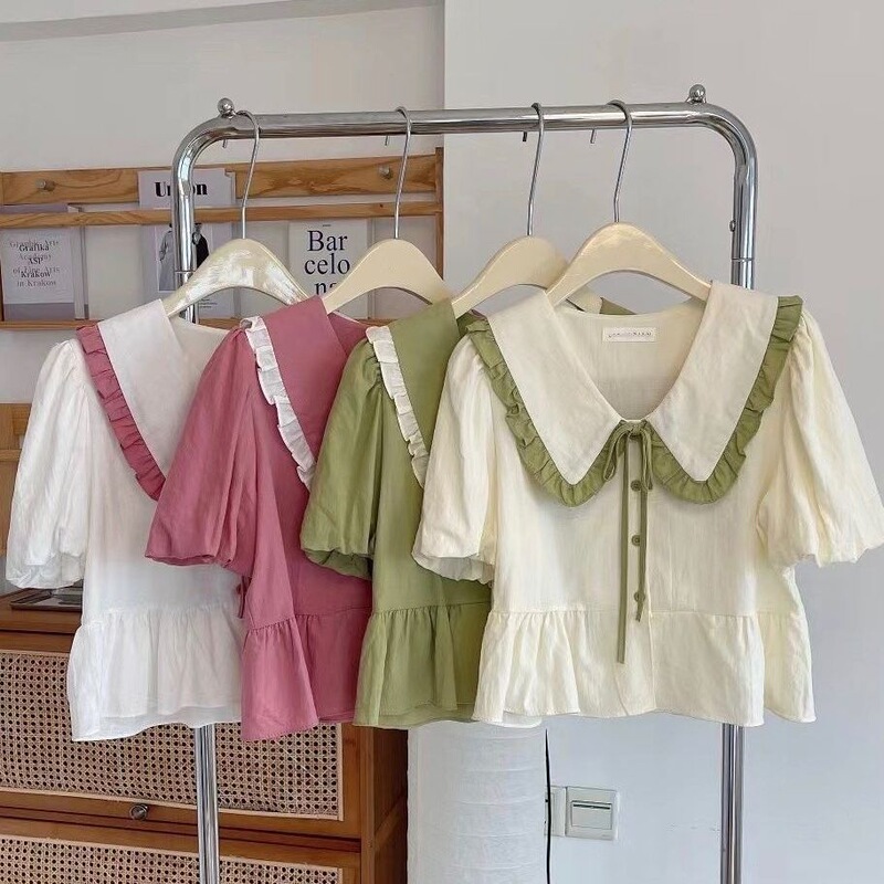 Sweet and Versatile Commuter-Style Shirt for Women, New Summer Model with Ruffled Edges, Tie-Up Doll Collar, Youthful and Stylish Short Design Sweet and Versatile Commuter-Style Shirt for Women, New Summer Model with Ruffled Edges, Tie-Up Doll Collar, Youthful and Stylish Short Design