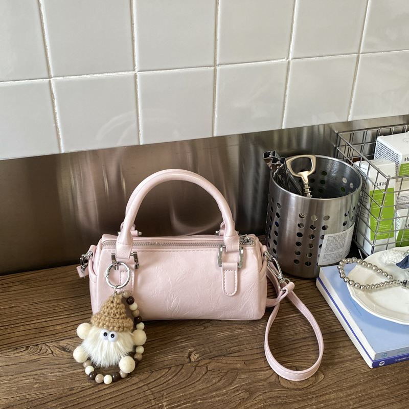 Nicho de diseño retro bolso de mano mujer 2026 primavera nuevo bolso de hombro sensación diaria de moda oblicuo bolso cilíndrico