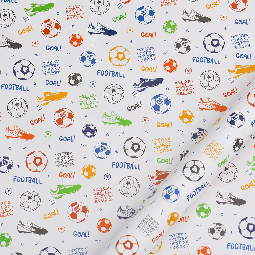 Nuevo papel de regalo de dibujos animados transfronterizo al por mayor Papel de embalaje de baloncesto de fútbol del Día de los niños en stock