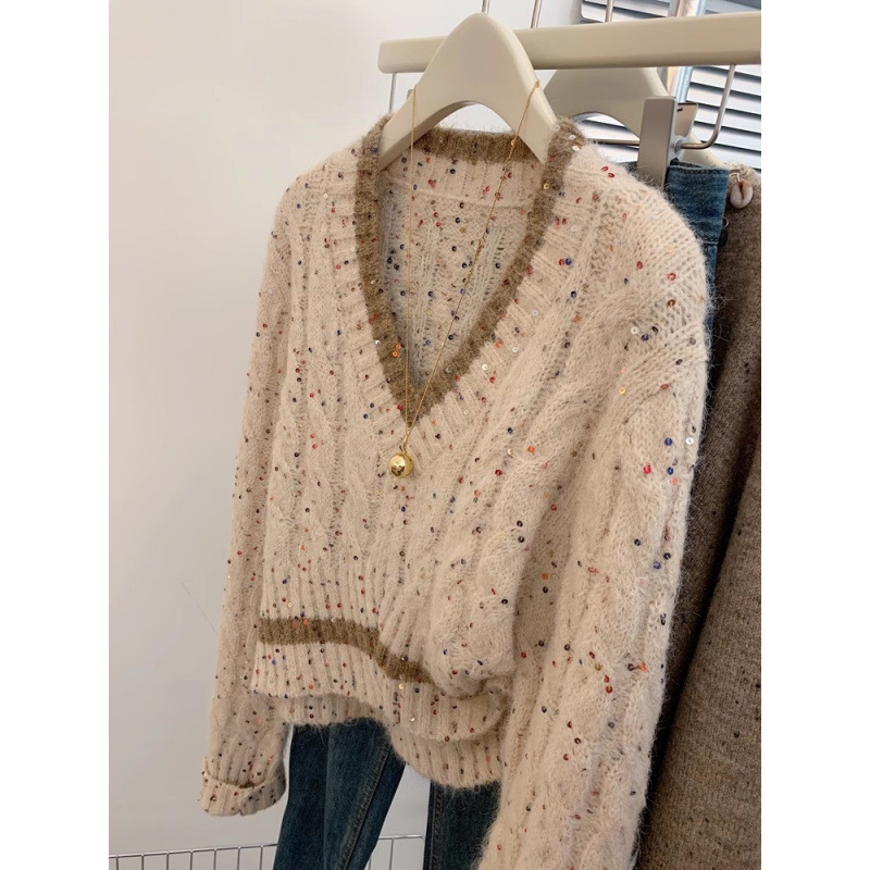 Mujeres coreanas envejecen y cuello alto único manteniendo cálido suéter casual suéter de diseño de otoño y invierno sensación de nicho camiseta de punto