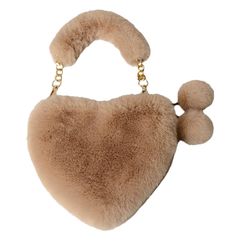 ウサギのぬいぐるみに似せて愛のバッグを持ってかわいいファッション女性のハート型バッグを持って肩を斜めに掛けて大容量の小銭入れをします。
