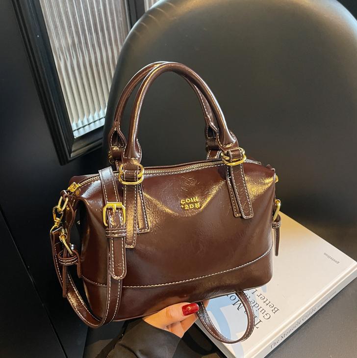 Nicho Zhong bolso de mano de tendencia retro mujer 2025 nuevo paquete de hombro casual universal viaje de alta calidad sensación de mochila