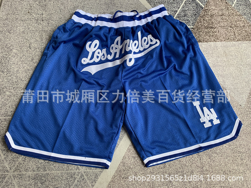 Comercio exterior pantalones de fútbol al por mayor Warriors Lakers 76 caliente Raptor mágico bolsillo bordado pantalones cortos pantalones de baloncesto NFL