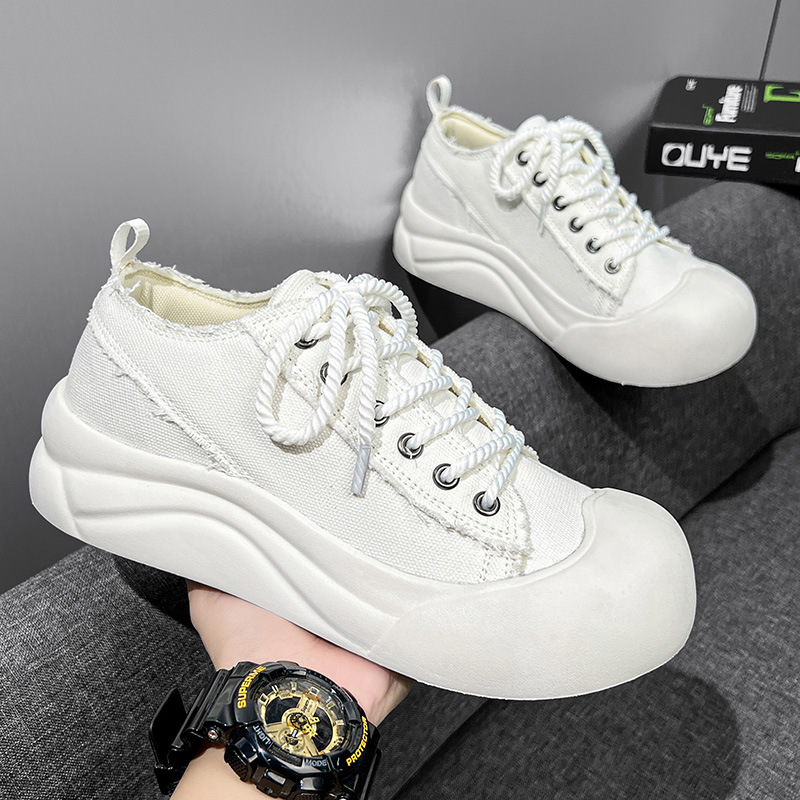 Diseño de nicho pareja zapatos de lona de cabeza grande suela gruesa zapatos casuales de todo fósforo otoño al aire libre zapatos de skate de moda coreana