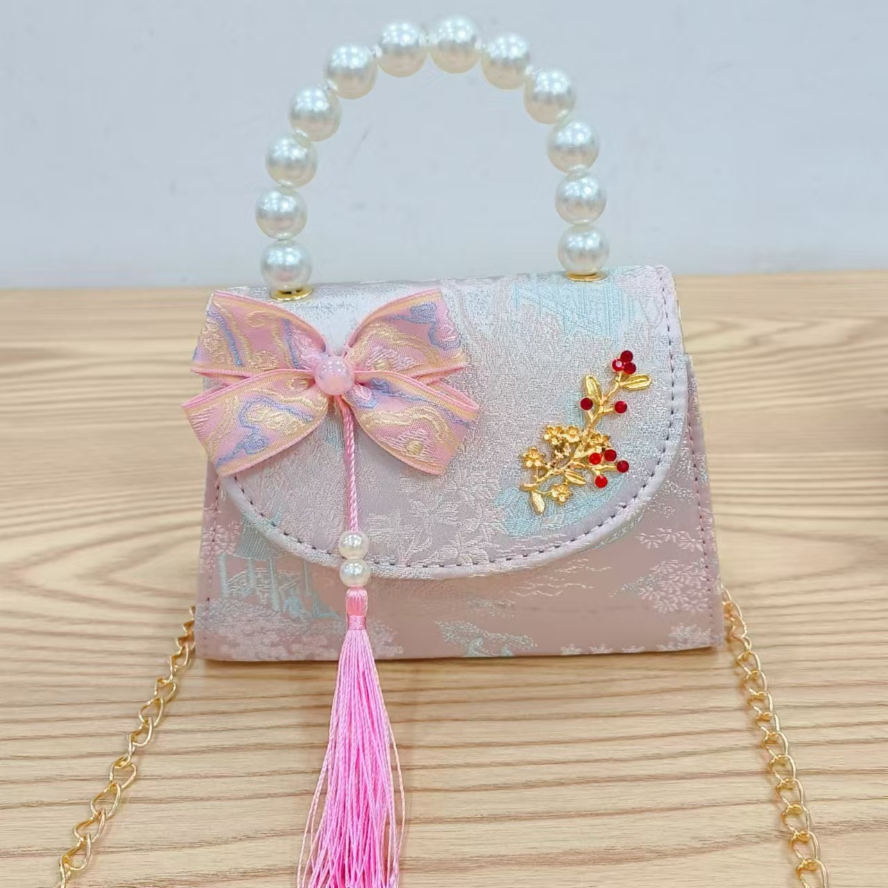 Bolsas de niños arco de estilo chino borda de niña pequeña princesa perla bolsa de cambio de mano al por mayor