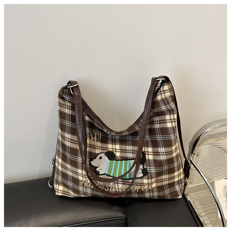 A new 2024 trendy and stylish backpack for women, featuring a cartoon checkered single-shoulder crossbody bag and a tote bag undefined