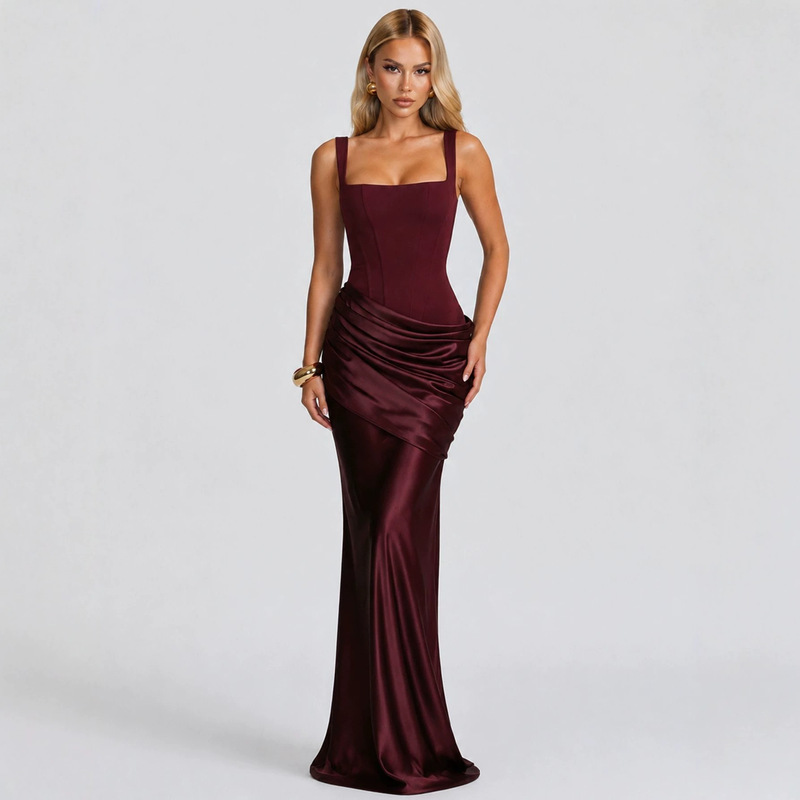 Elegant women's sleeveless satin slip dress with a cinched waist and an asymmetrical pleated hem, suitable for formal occasions