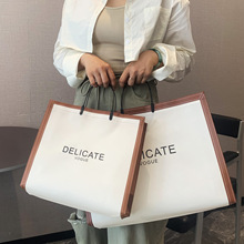 定制手提高档服装店装衣服袋子包装防水无纺布插耳袋定做logo