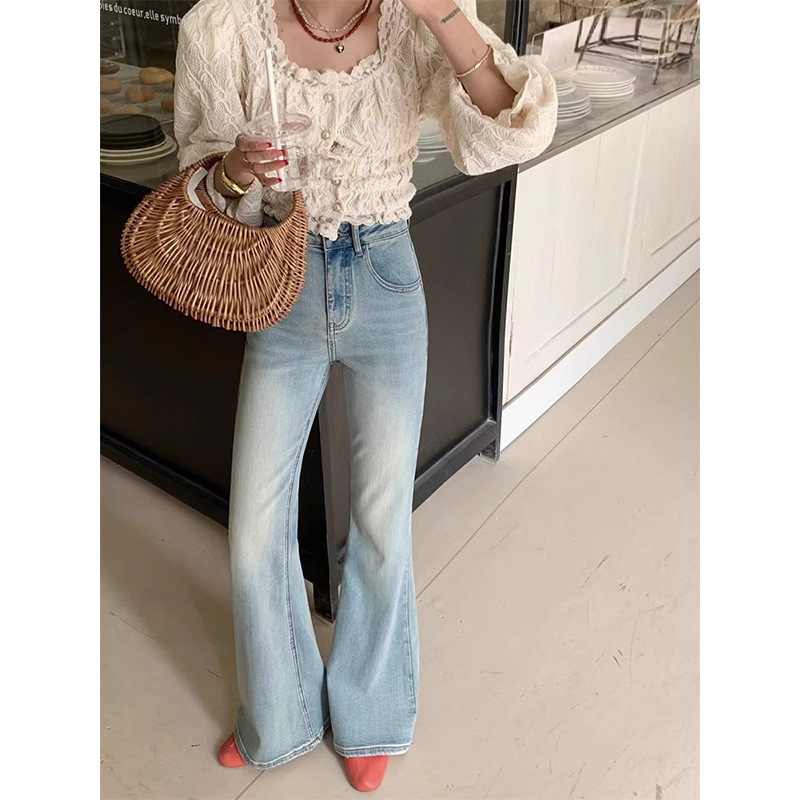 A pair of light color nostalgic blue flare jeans for women in 2024 autumn new high-waist slimming straight-flare trousers