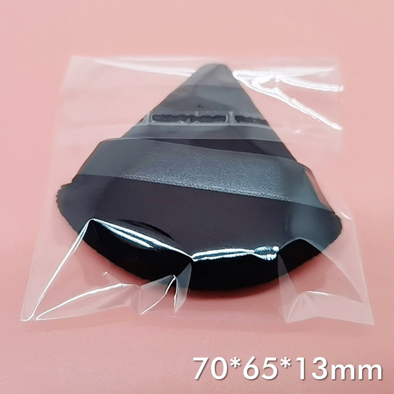 三角形の植毛パフの乾燥パフの柔らかい短い毛の尖った形のエアクッションの化粧品のハンドフックパフの化粧道具の卸売り|undefined