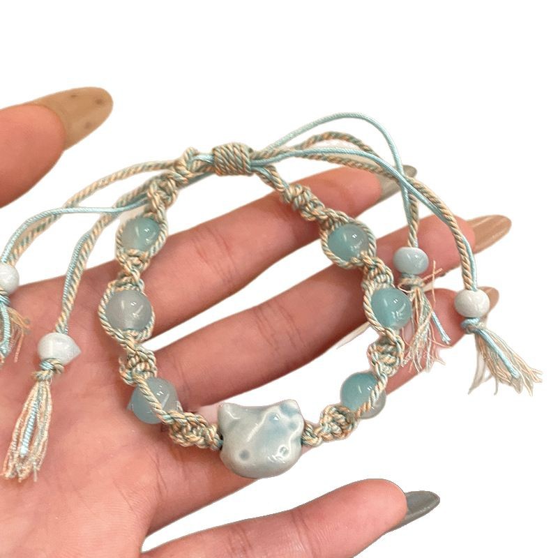 Pulsera de cuerda de color de gatito de cerámica linda de dibujos animados, pulsera de todo fósforo de nicho dulce, joyería de temperamento de alta gama de moda para mujer