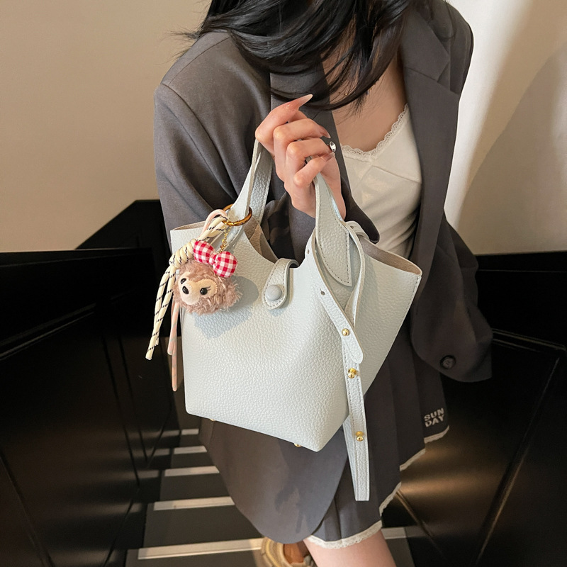 Bolso de canasta de verduras transfronterizo para mujer 2025 nuevo bolso de hombro casual simple bolso de cubo de mensajero de cuero suave de todo fósforo