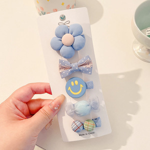 Hermosos clips de cabello de color para niños coreanos de alto nivel sensación de arco de niñas bolsa de tela no daña clips de cabello de bebé