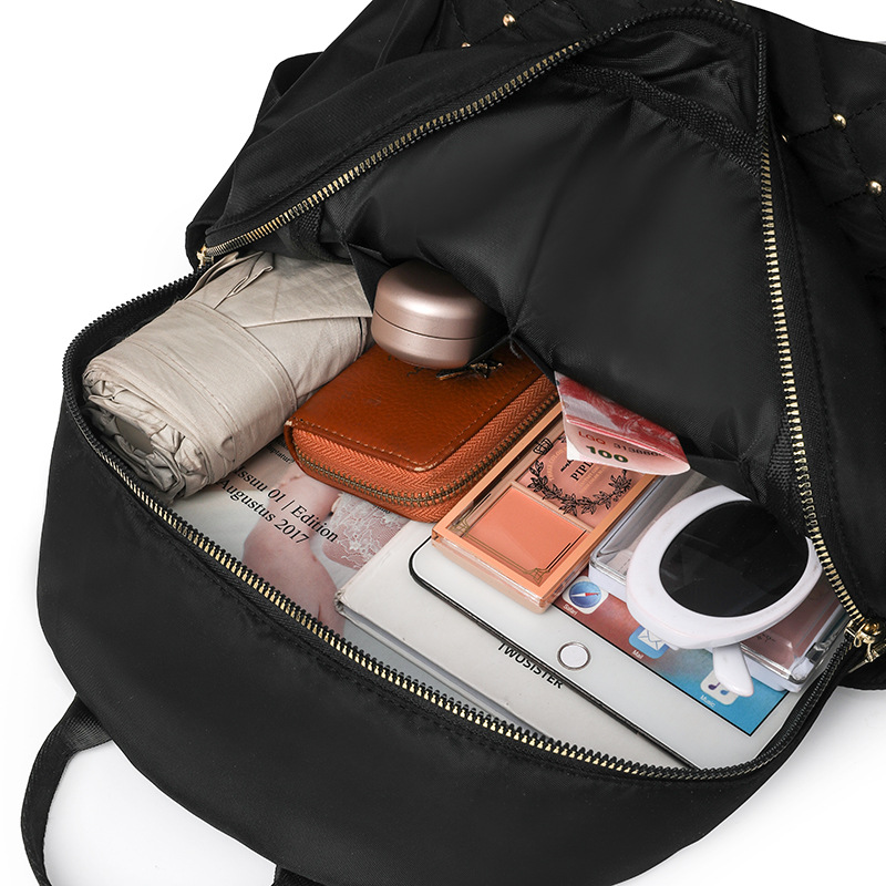 Comercio exterior al por mayor 2024 nuevo estilo casual señoras Lingge mochila moda remache color contraste mochila ligera mochila escolar marea